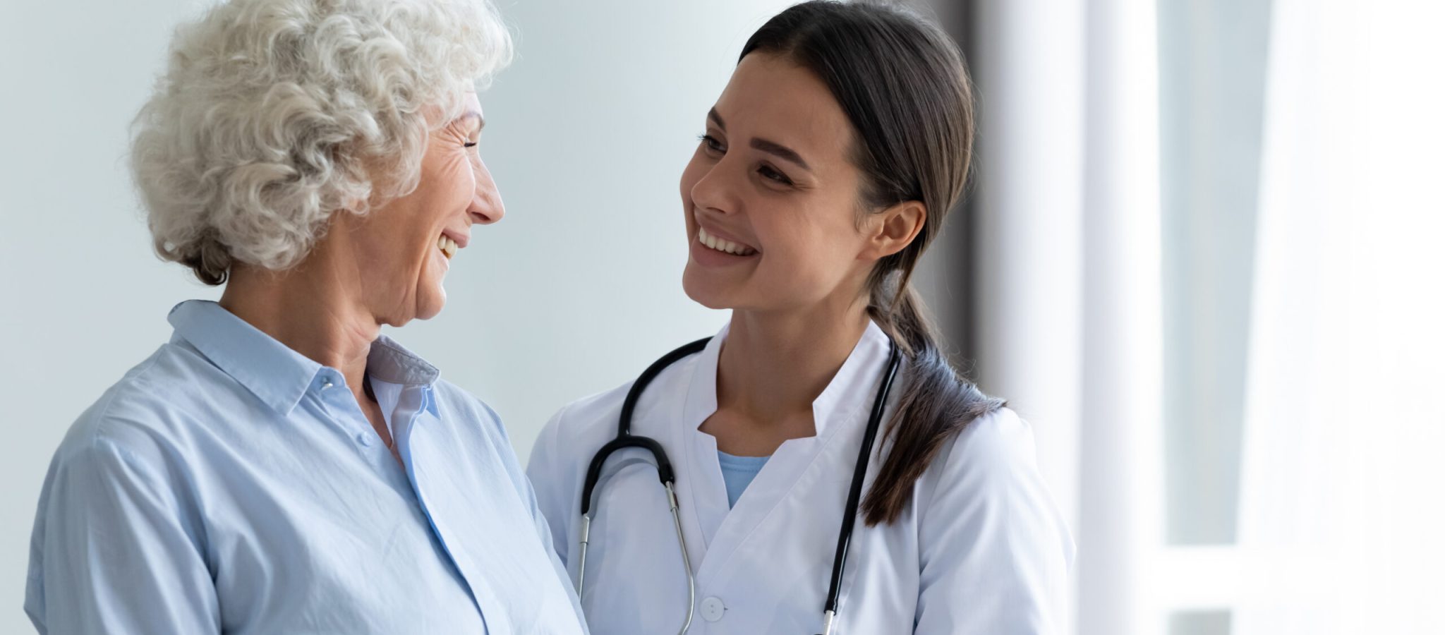 Smiling,Caring,Young,Female,Nurse,Doctor,Caretaker,Assisting,Happy,Senior